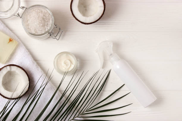 istock Cosmetic jars and coconut on the table close-up and place for text. 1314445480