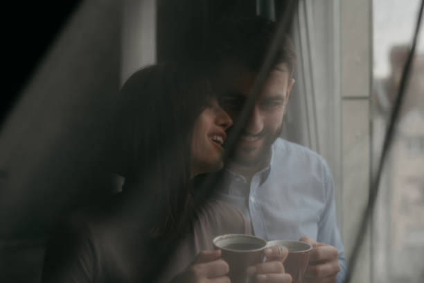 istock Couple behind the curtain 1314449226