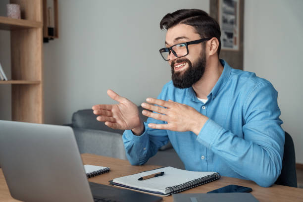istock Millennial male teacher, coach or trainer having video call conversation 1314452308