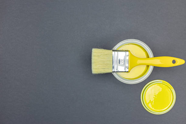 istock open can of paint with paintbrush on it on grey background. top view flat lay. 1314453513
