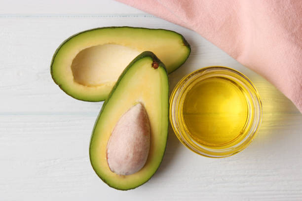 istock Avocado and avocado oil close up on the table 1314454267