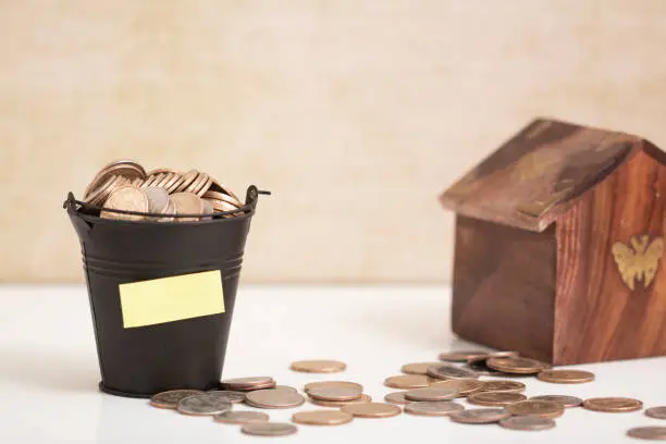 dollar coins in a bucket