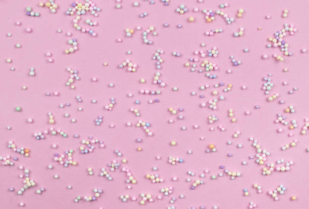 istock Small colorful pastel balls on pink paper 1314459742