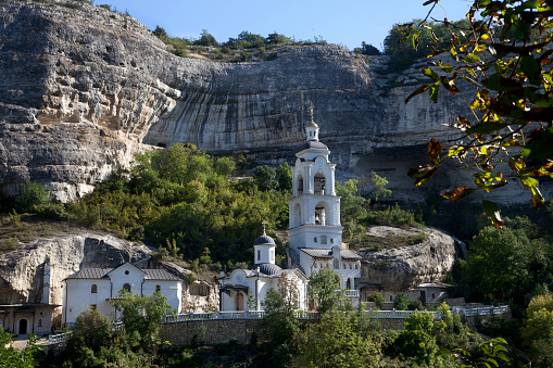 View of the bell tower of the Holy Dormition Monastery in the Crimea, in Bakhchisarai in summer.