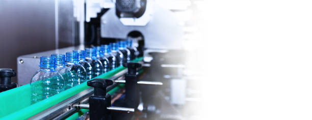 istock plastic Bottles transfer on Automated conveyor systems industrial automation for package 1314461129