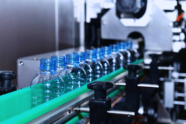 istock plastic Bottles transfer on Automated conveyor systems industrial automation for package 1314461789
