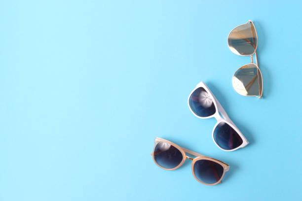 istock set of sunglasses on a colored background top view. 1314461858