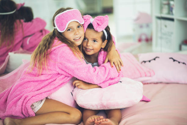 istock Two little girls on bed in hug. 1314461868
