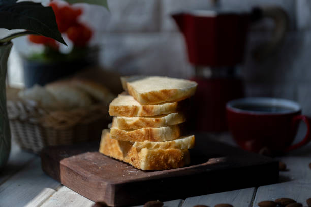 slices of loaf bread and coffee on table in the morning