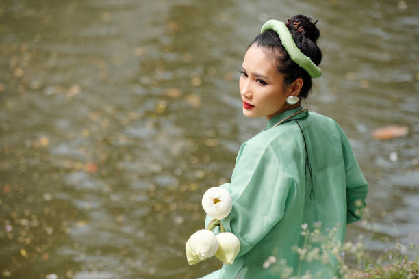 istock Attractive woman standing by water 1314462340