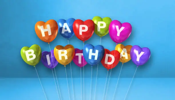 Colorful happy birthday heart shape air balloons on a blue background scene. Horizontal Banner. 3D illustration render