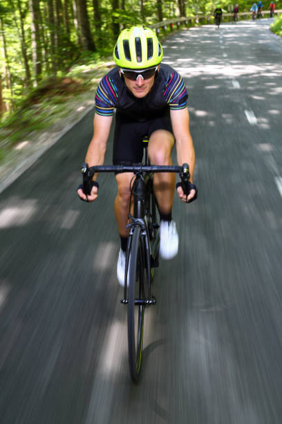 istock Bicycle rider going down a mountain road 1314464158