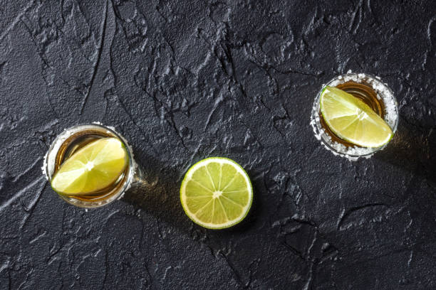 istock Tequila shots with salt and lime slices, top shot 1314465912
