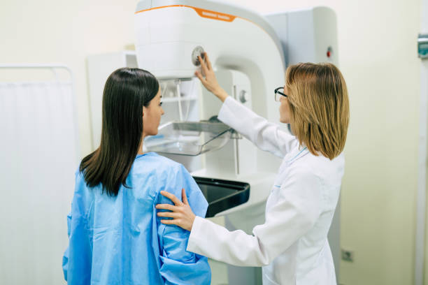 Young woman is having mammography examination at the hospital or private clinic with a professional female doctor. stock photo