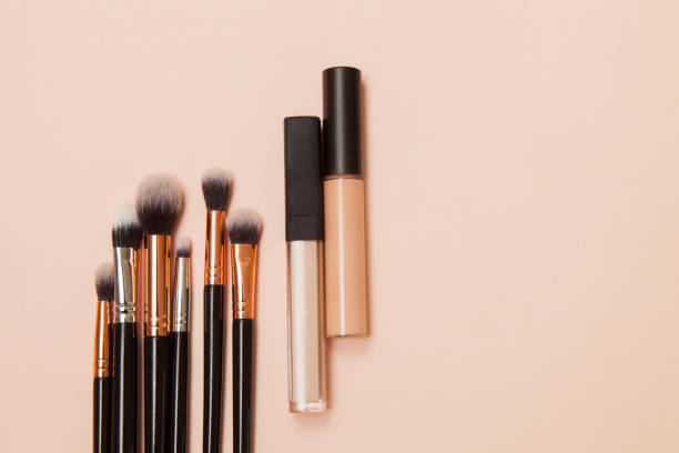 istock Various cosmetic brushes on pink background. Makeup brushes set for take care skin. 1314466984