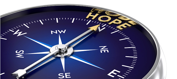Compass made of metal and blue color. needle pointing to the golden hope word. Marketing concept. 3D illustration
