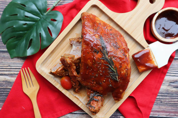 istock Barbecue pork ribs served on wood tray - Top view BBQ on rustic background 1314468623