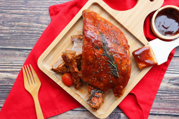istock Barbecue pork ribs served on wood tray - Top view BBQ on rustic background 1314468646
