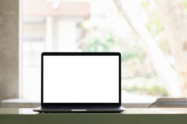 istock White blank screen tablet on modern working desk with garden background. 1314469319