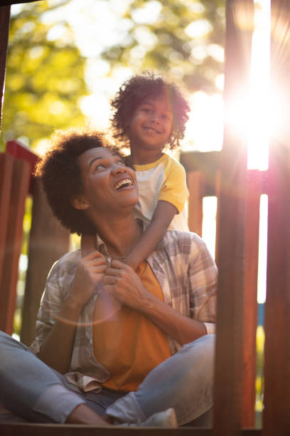 istock Mother and daughter on playground. 1314469609