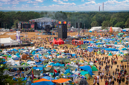 Kostrzyn Nad Odra, Poland - August 02, 2019:Thousands young people walking through the huge campground with hundreds of tents at 25th Pol'and'rock Festival - the biggest open air ticket free rock music festival in Europe