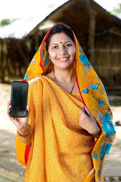 istock Indian woman showing mobile phone 1314470896