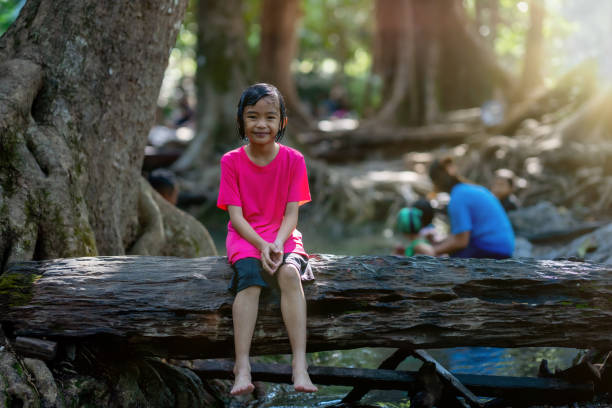 Girl sitting on a bridge
