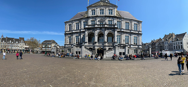 Bruges, Belgium, 07/21/2020: Main square and historic buildings in the city center