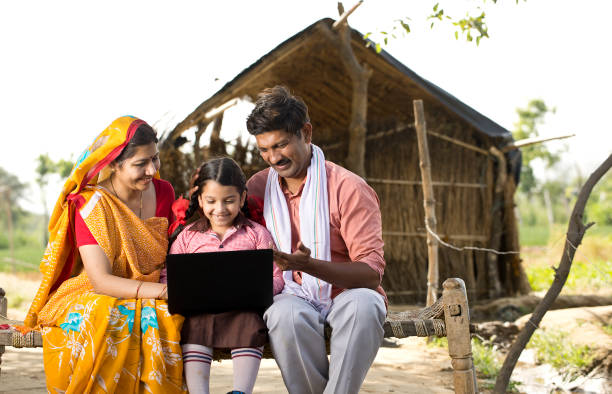 istock Parents with daughter using laptop on traditional bed 1314473797
