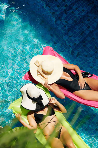 istock Fit women sunbathing together 1314474427