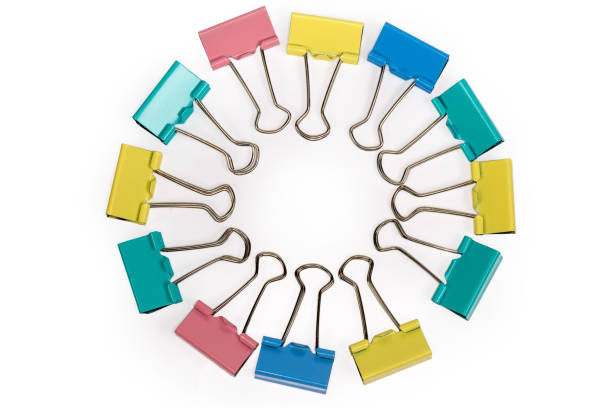 istock Top view of multi colored binder clips laid out circle 1314475025