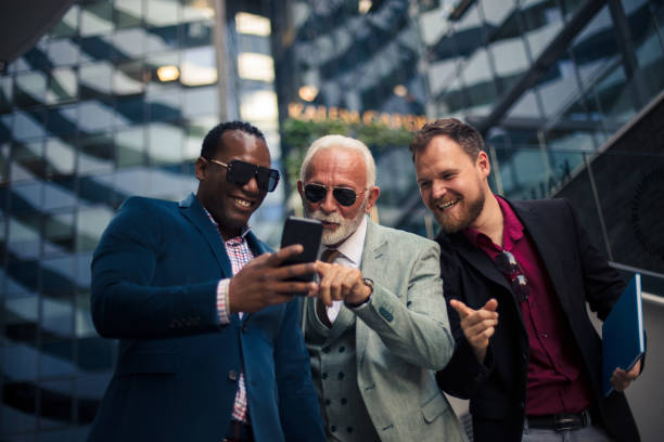 istock Business colleagues reading a text on smart phone. 1314475545