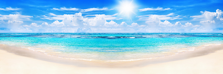 Beautiful tropical beach panoramic view, turquoise sea water, ocean waves, yellow sand, sun in blue sky, white clouds, hot summer holidays, exotic island vacation, Caribbean travel, Maldives landscape
