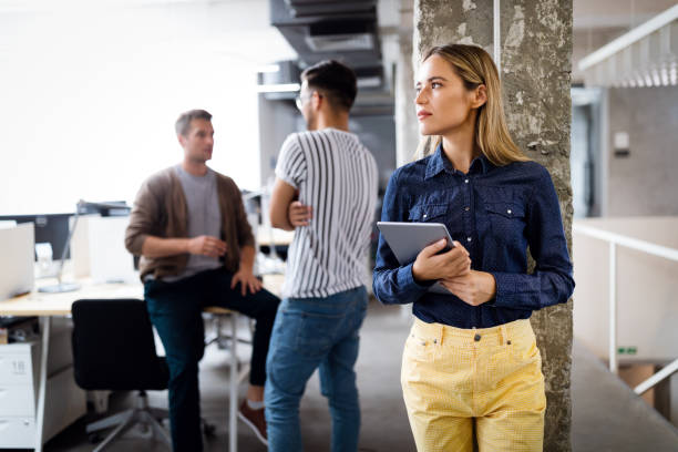 istock Business people having fun and chatting at workplace office 1314478732