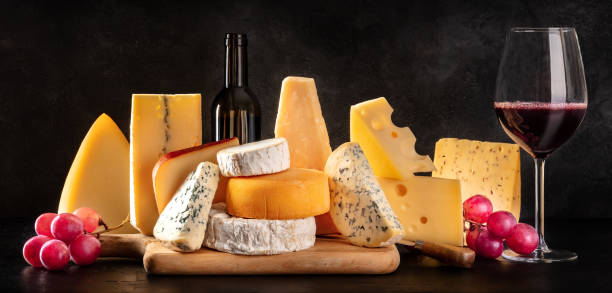 istock Cheese and wine panorama with many different types of cheese 1314478980