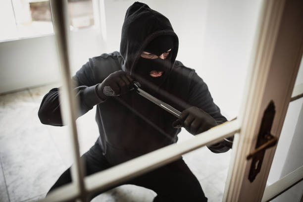 istock Criminal trying to brake in house 1314481631
