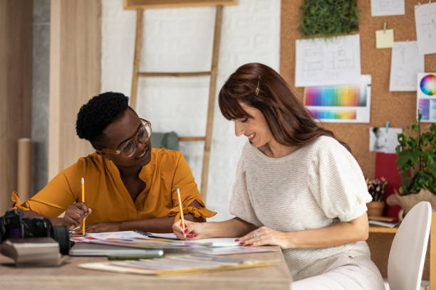 istock Two female entrepreneurs writing down ideas for upcoming projects together 1314482005