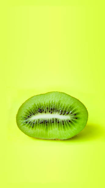 istock Beautiful kiwi on a yellow background. 1314483222