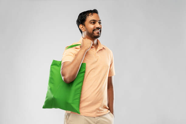 istock man with reusable canvas bag for food shopping 1314487400