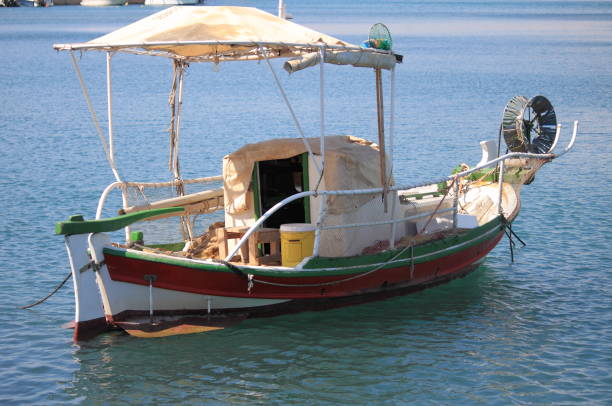 istock Multicoloured fishing boat in Greece 1314488372