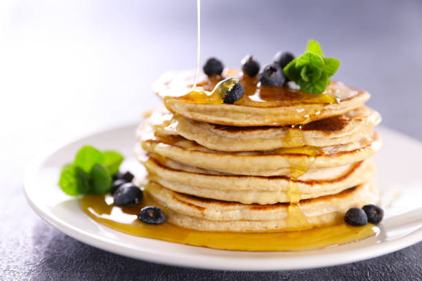 istock pile of pancake with pouring syrup 1314489551