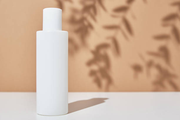 istock Cosmetics beauty mockup. White bottle on pastel background 1314489599