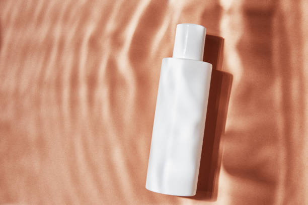 istock Cosmetics beauty mockup. White bottle on pastel ripples background 1314489610