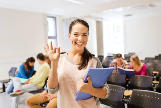 istock group of smiling students in lecture hall 1314489721