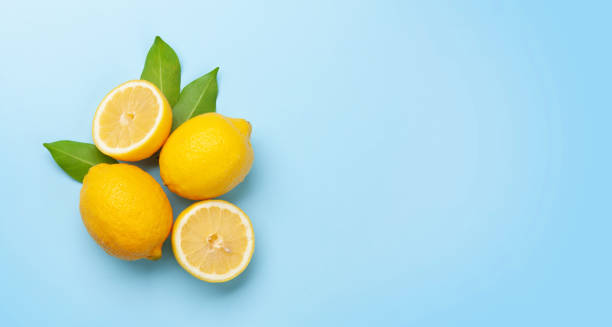 istock Fresh ripe lemons on blue background 1314489797