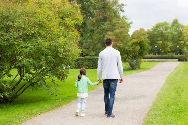 istock happy family walking in summer park 1314490083