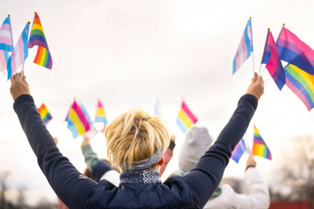 istock Diverse people on a transgender demonstration holding transgender flags 1314491467