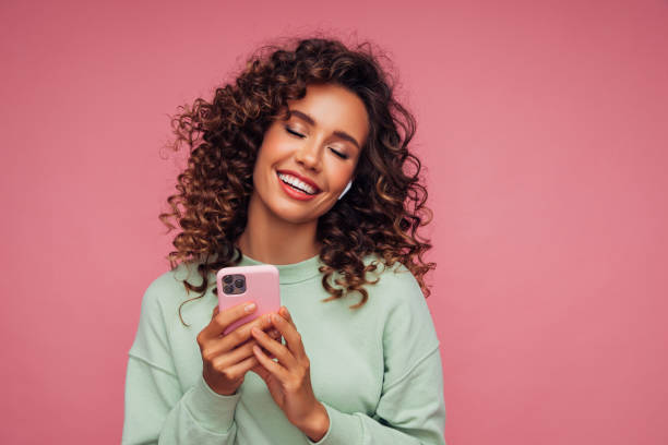 istock Beautiful woman with smart phone 1314491677