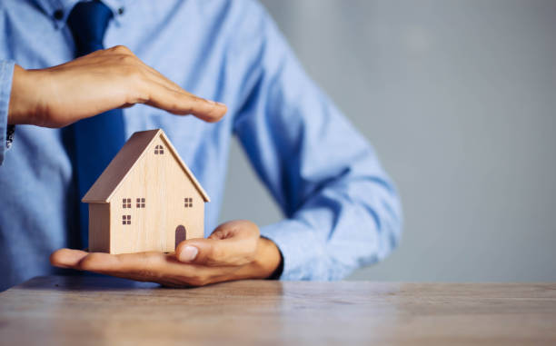 istock The insurance agent presents  the hands protection model that symbolize the coverage. 1314491684