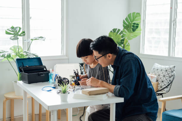 istock Asian Father and son building robot at home as a school science project 1314491719